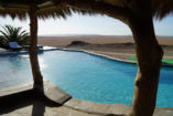 At the pool of the Rostock Ritz Desert Lodge you can perfectly relax with a wonderful view.