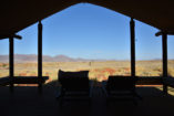 The luxury camp provides exclusive views over the surrounding desert landscape.