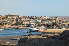 View of the harbor and, in the center left of the picture, the waterfront with jetty